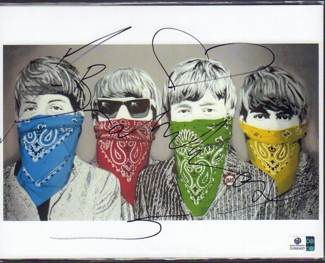 Mr. Brainwash: A Beatles 8x10 image signed by pop artist many believe is actually the infamous anonymous Banksky signed with Global Authentics sticker his work sells for thousands of dollars even as Mr Barinwash