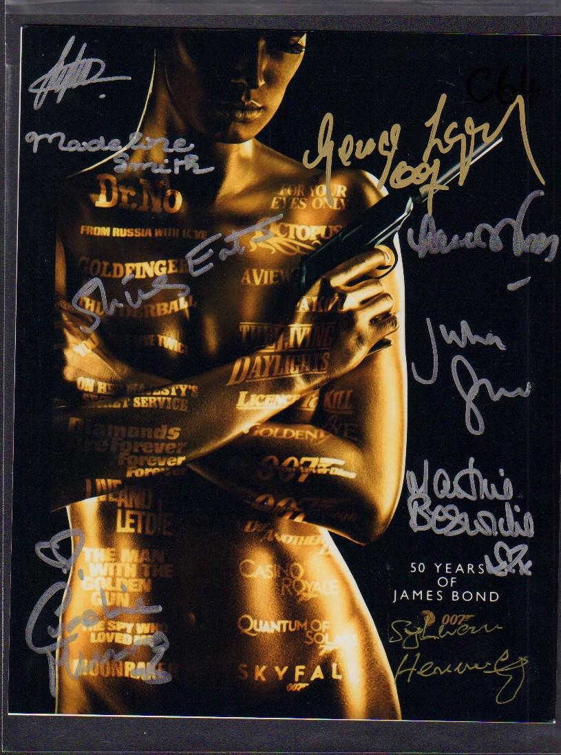 50 Years of James Bond ensemble: A color 8x10 signed at two Bond conventions years ago by Bond star George Lazenby, Bond babes Shirley Eaton, Lana Wood, Martin Beswicke, Caroline Munro, Madaline Smith and villains Julian Glover plus 
