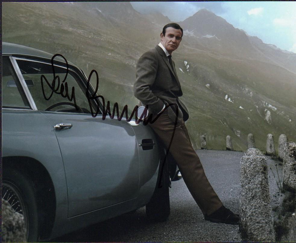 Sean Connery: A color Bond shot 8x10 by the classic Aston Martin DB4 car signed by Connery POP COA