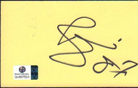 David Bowie: A signed yellow 3x5 card by Bowie with Global Authentics sticker as well as our COA