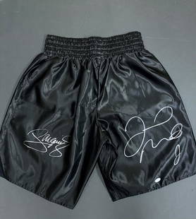 Manny and Floyd signed boxing trunks JSA: Black satin boxing shorts heres the story they were sent to embroider their names on the band but they embroidered some with wrong name SO Floyd Mayweather and Manny Pacquio resigned the other side