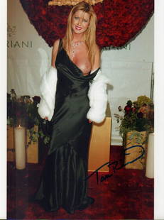 Tara Reid: A color papparazzi signed 8x10 of her with wardrobe malfunction signed ! With COA