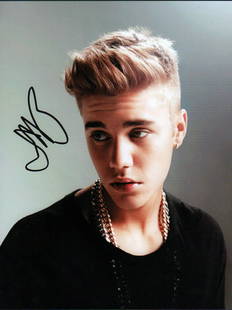 Justin Bieber: A vintage YOUNG color signed 8x10 pre tattoos