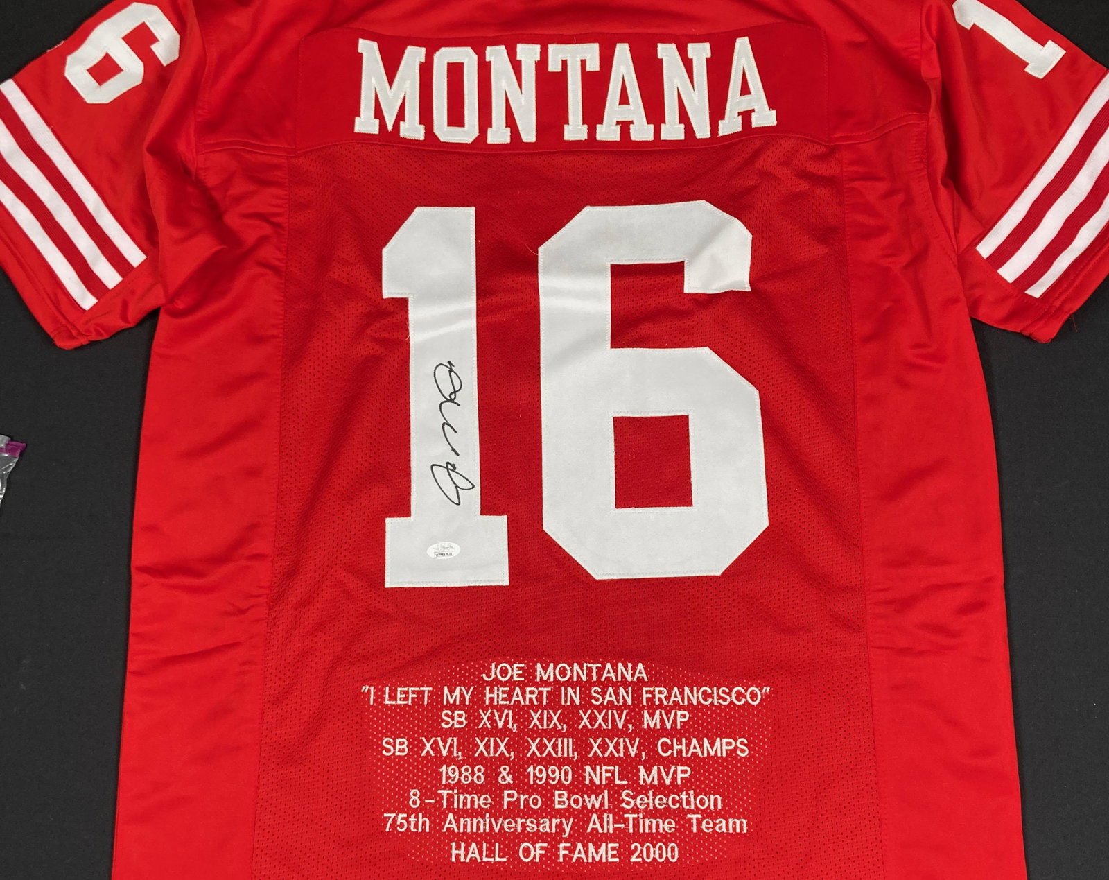 Joe Montana jersey signed: A nice embroidered jersey signed by the legend with STATS embroidered and JSA sticker