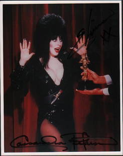 Elvira Cassandra Peterson signed photograph: Years ago she would sometimes sign her real name and characters name as in this vintage signed 8x10 with COA scarce thus