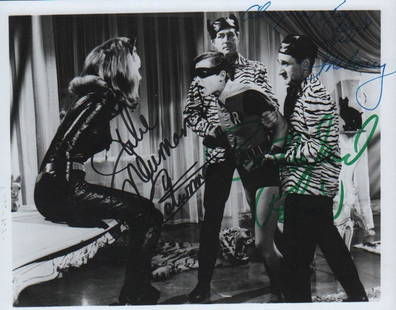 Batman TV rarity signed photograph: An unusual signed bw 8x10 by Julie Newmar as Catwoman which she adds Burt Ward as Robin which he added and Jock Mahoney as the other villain with COA