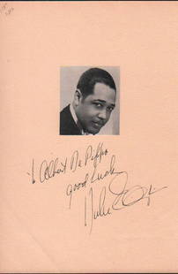 Duke Ellington signed page: A larger 7x9 page signed in fountain pen ink by the rare Duke Ellington with his image attached to page with COA