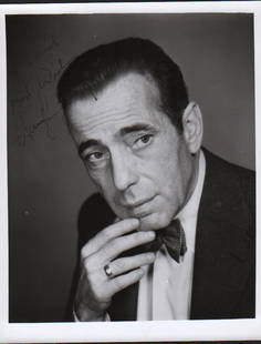 Humphrey Bogart signed photograph: A wonderful vintage bw portrait 8x10 signed by Bogie to fan with COA