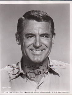 Cary Grant signed photograph: A wonderful smiling 1959 signed photograph from film by the legend with COA