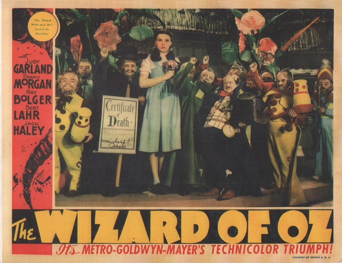 Meinhardt Rabbe Wizard of Oz repro lobby card: A large 11x14 repro of the Oz lobby card showing the munchkin actor as the coroner signed by him with COA