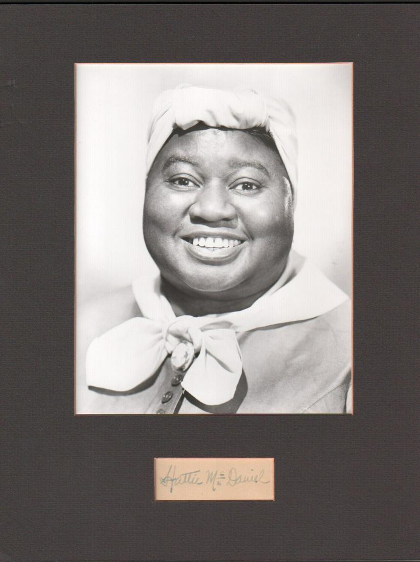 Hattie McDaniel rare Gone with the Wind signature: A rare signature of the FIRST African American to win an Oscar for her role as the Mammy in Gone with the Wind matted with image of her from the film with COA