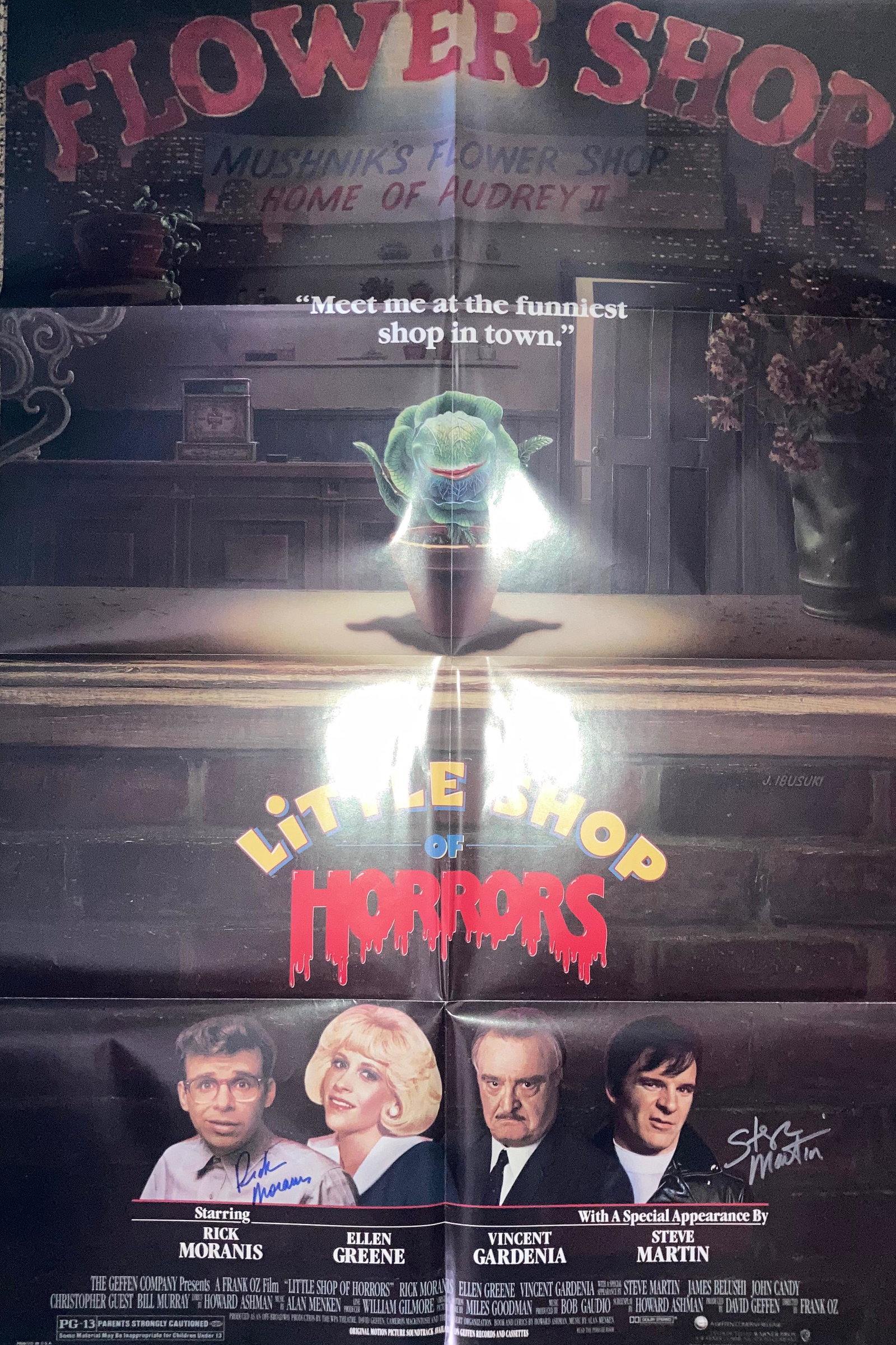 Little Shop of Horrors movie poster signed: An original folded as issued near Mint poster to the classic film signed by Steve Martin and Rick Moranis with COA