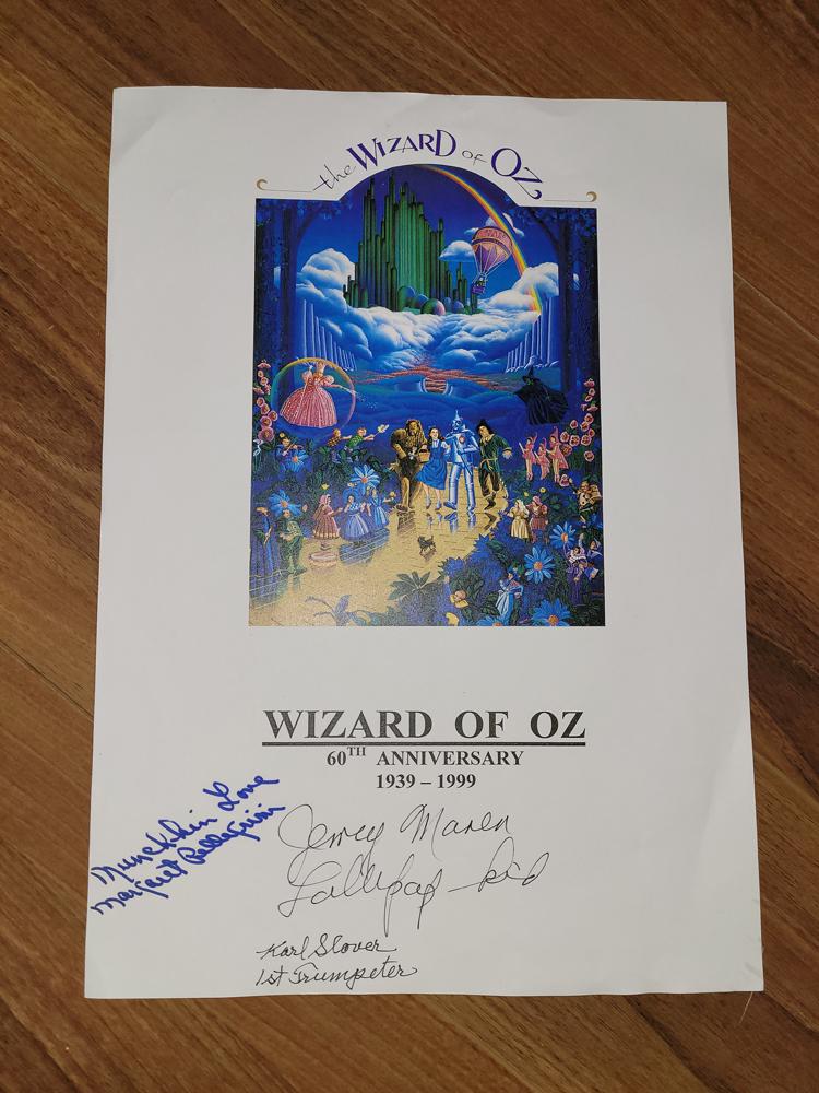 Wizard of Oz Munchkins poster signed: A custom 11x14 print signed on the 60th Anniversary of the film by munchkin stars Jerry Maren Margaret Pellegrini and Karl Slover the then survivors with COA