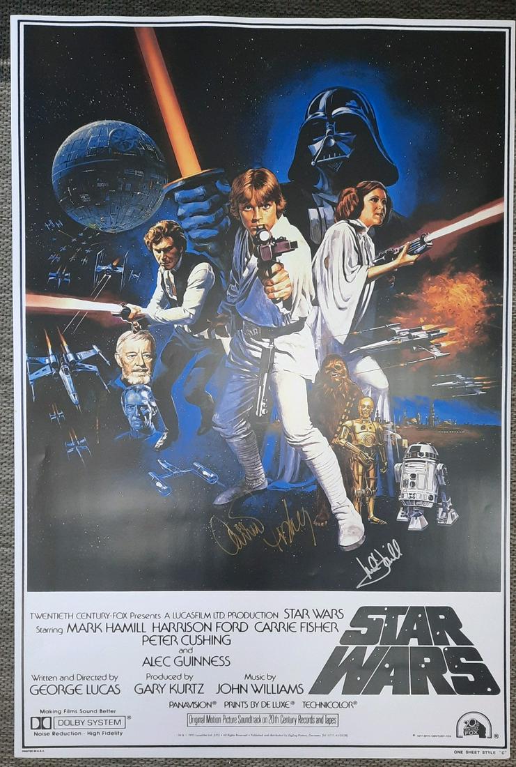 Star Wars movie poster signed by Hamill and Fisher: Obtained at the Hollywood Show in gold ink by her and the Star Wars celebration by Hamill later in silver ink on a repro of the original poster 27x40 with COA