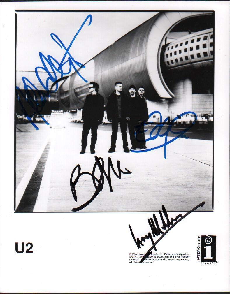 A rare record company photo signed by entire band BONO (1 of 1)
