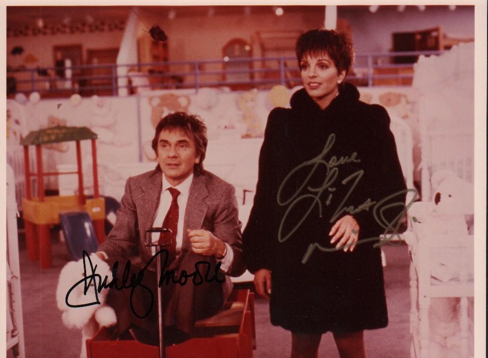 Arthur cast signed photograph: An original color vintage signed 8x10 from the film signed by both stars Dudley Moore and Liza Minelli with COA