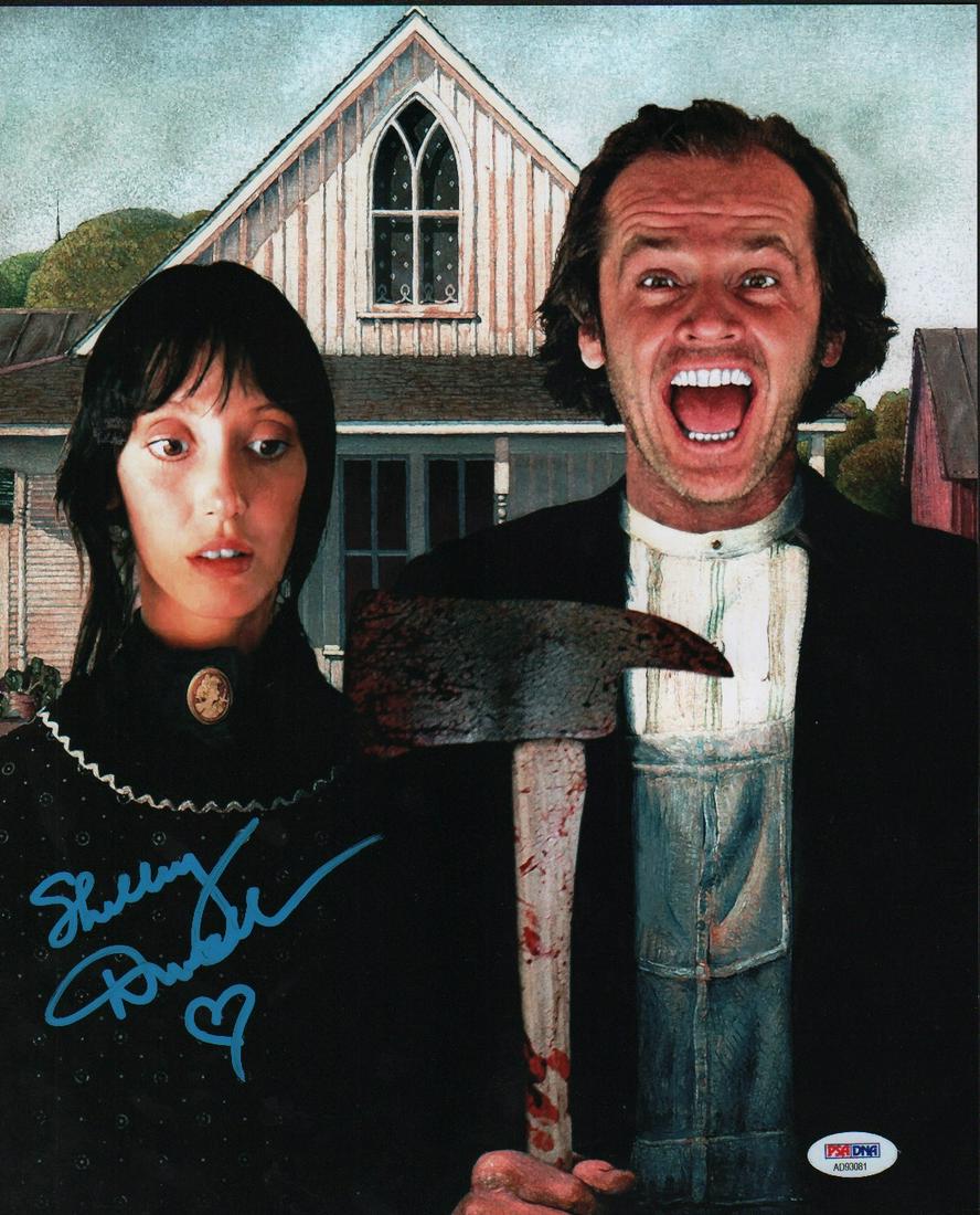 Shelley Duvall signed photograph: A color 11x14 Shining promotional shot signed by her in bright blue paint pen with a PSA sticker on it as well as our guaranteed coa