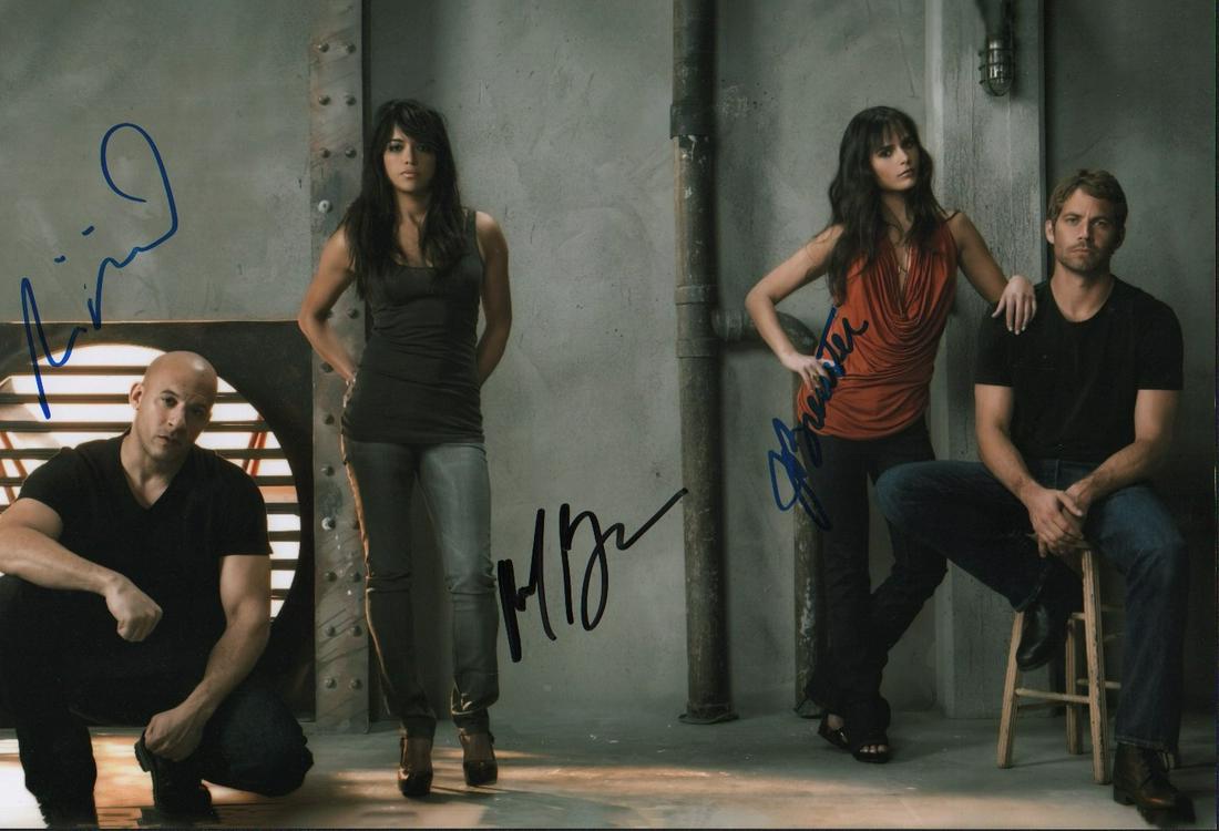 Fast and Furious cast signed photograph: A 11x14 photograph signed by Vin Diesel Michelle Rodriguez and Jordana Brewster with COA