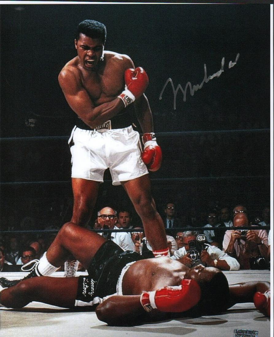 Muhammad Ali signed 11x14 photograph: A scarce Muhammad Ali signed 11x14 with Sports N More hologram nice !