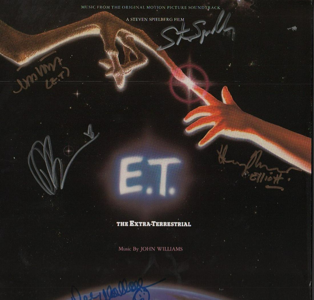 ET soundtrack cast signed LP: A soundtrack LP to the classic film signed by Henry Thomas as Elliott Drew Barrymore Director Steven Spielberg Dee Wallace Stone and Merritt the voice of ET with COA