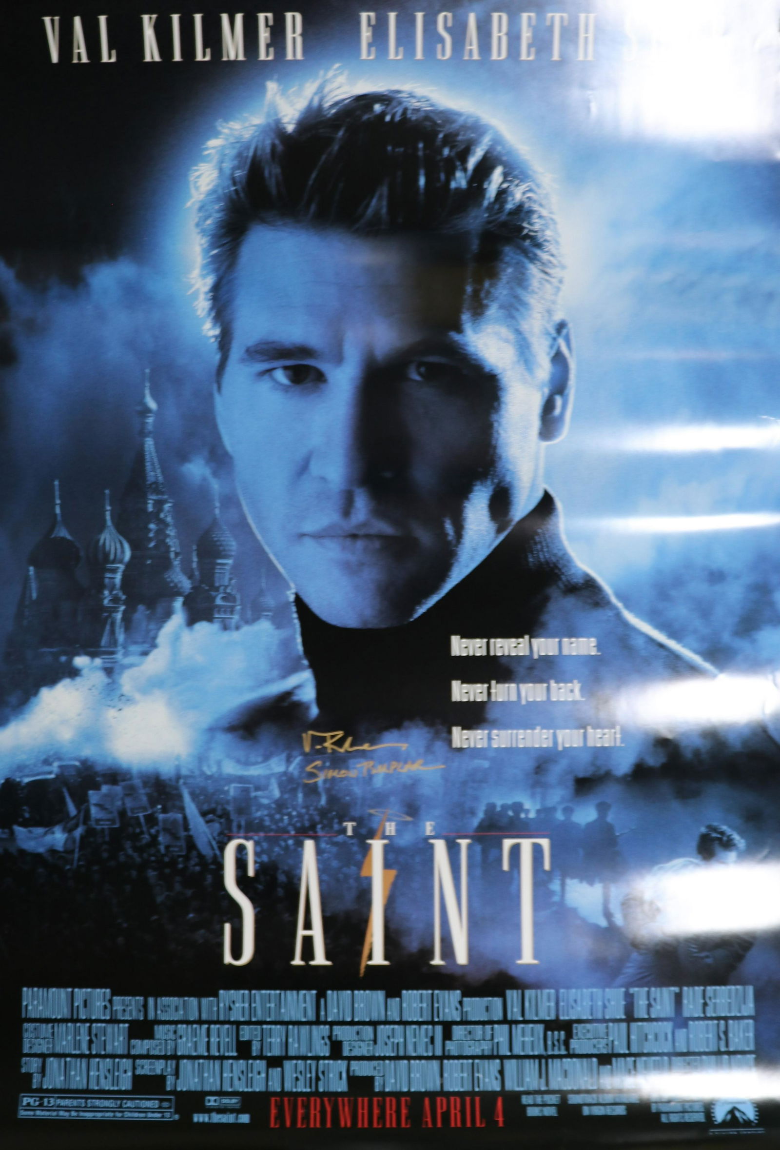 Val Kilmer Saint poster signed: An original one sheet double sided RARE version of the SAINT movie poster signed by Val Kilmer adding the characters name Simon Templar with COA