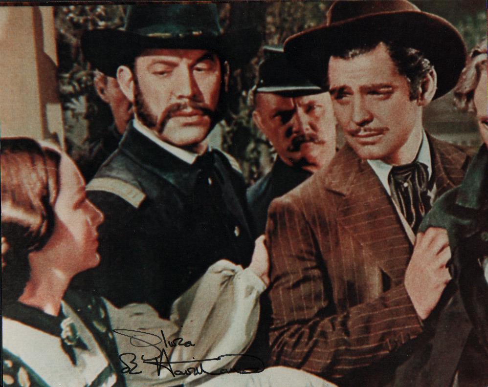 Olivia DeHavilland Gone with the Wind scarce photograph signed: A nice GWTW signed 8x10 by the star with COA