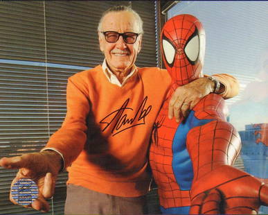 Stan Lee signed photograph with Spiderman: A Stan Lee signed 7x9 with one of his creations Spiderman with his own Stan Lee hologram sticker on it