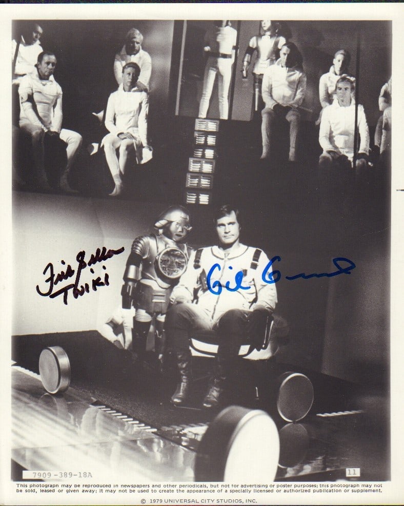Buck Rogers in the 25th Century signed photo: A rare original still signed by star Gil Gerard and his sidekick Twiki Felix Silla with COA