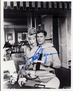 I Dream of Jeannie cast signed photograph: Vintage still signed by both stars Barbara Eden and Larry Hagman Certificate of AuthenticityEVERY item in this auction comes with at minimum a full illustrated serial numbered COA signed by the worlds