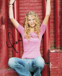 Taylor Swift young signed photograph Cute: A sexy young signed Swift 8x10 photograph by the now BILLIONAIRE pop star ! Certificate of AuthenticityEVERY item in this auction comes with at minimum a full illustrated serial numbered COA signed