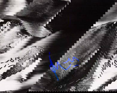 Harrison Ford signed photograph: A bw Indiana Jones signed 8x10 obtained in person unusual shot seldom seen Certificate of AuthenticityEVERY item in this auction comes with at minimum a full illustrated serial numbered COA signed by
