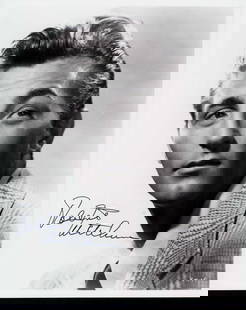 Robert Mitchum signed photograph: A nice young vintage signed 8x10 of the star Certificate of AuthenticityEVERY item in this auction comes with at minimum a full illustrated serial numbered COA signed by the worlds leading authenticat