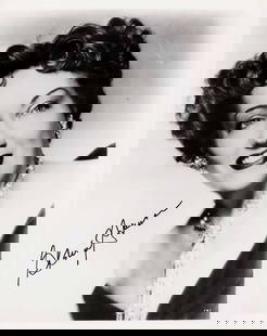 Gloria Swanson signed photograph: A wonderful vintage signed portrait of the silent and talking era star of such classics as Sunset Boulevard Certificate of AuthenticityEVERY item in this auction comes with at minimum a full illustrat