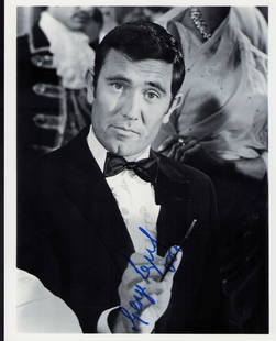 George Lazenby James Bond signed photograph: As James Bond signed 8x10 Certificate of AuthenticityEVERY item in this auction comes with at minimum a full illustrated serial numbered COA signed by the worlds leading authenticator in Entertainment