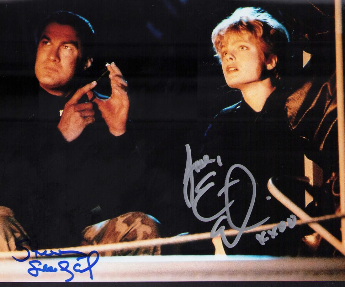 Under Siege cast signed photograph: Stephen Seagal and Erika Eleniak signed 8x10 from the movie Certificate of AuthenticityEVERY item in this auction comes with at minimum a full illustrated serial numbered COA signed by the worlds lead