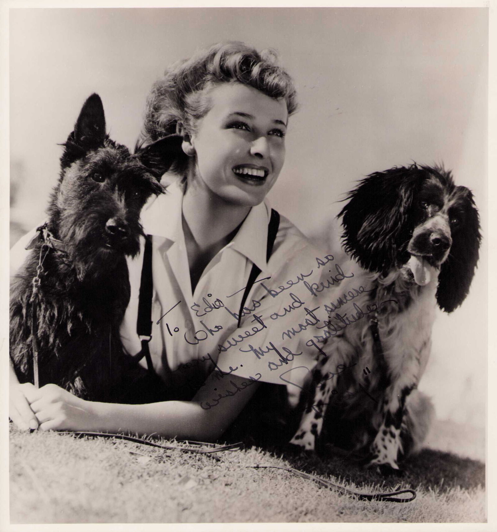 Laraine Day signed photograph: An odd sized 12x10 of her with her puppies To Edio whho has been so sweet and kind to me my best wishes and grattitude Lauraine and "Daisy" the dogs name Certificate of AuthenticityEVERY item in this