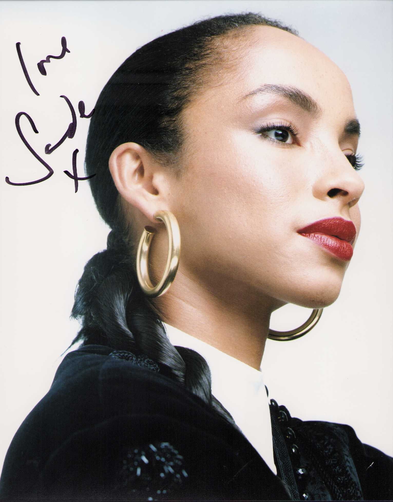 Sade signed photograph: Sultry signed portrait of singer 8x10 photograph Certificate of AuthenticityEVERY item in this auction comes with at minimum a full illustrated serial numbered COA signed by the worlds leading authent