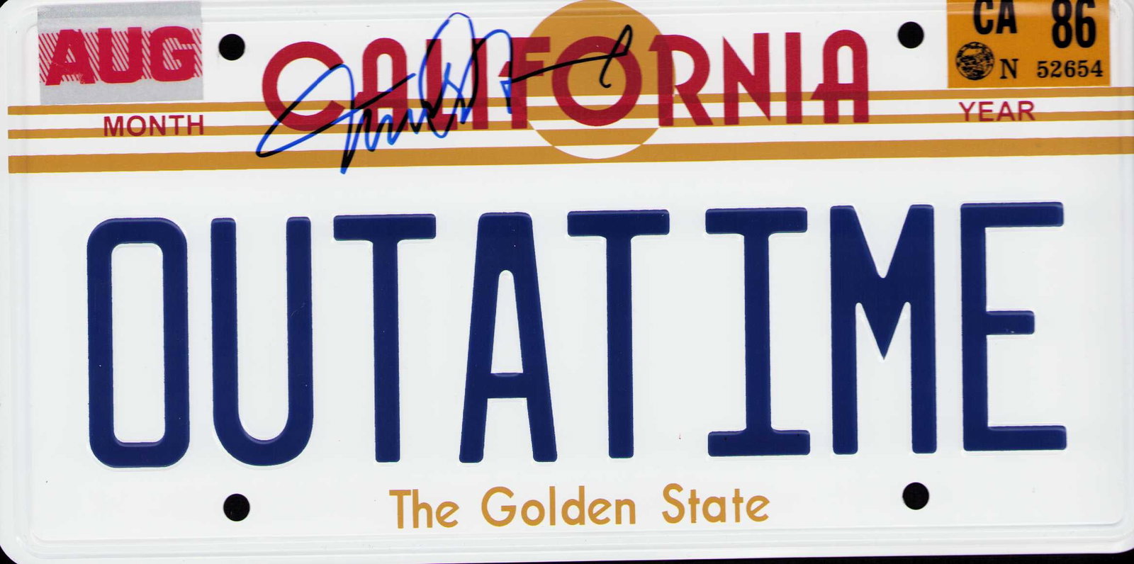 Back to the Future signed license plate: An embossed metal stickered exact replica license plate from Back to the Future approx 10 ounces and 6x12 signed by star Michael J Fox Certificate of AuthenticityEVERY item in this auction comes with