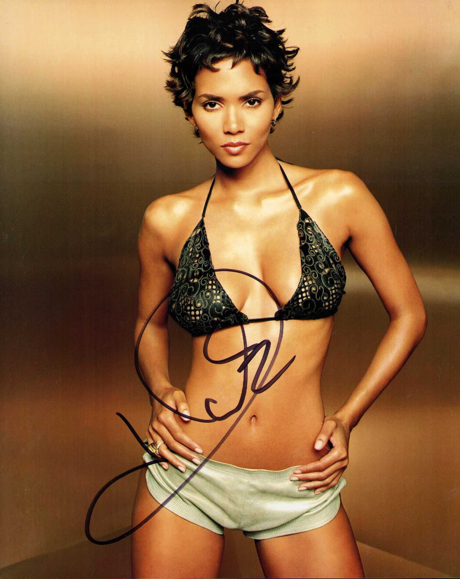 Halle Berry sexy signed photograph: A sexy vintage signed 8x10 of the actress Certificate of AuthenticityEVERY item in this auction comes with at minimum a fully illustrated and serial numbered COA signed by the worlds leading authentic