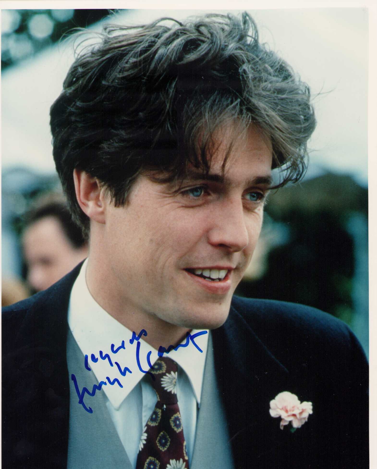 Hugh Grant vintage signed photograph: A vintage signed early movie still by the hard signer to obtain Certificate of AuthenticityEVERY item in this auction comes with at minimum a fully illustrated and serial numbered COA signed by the wo