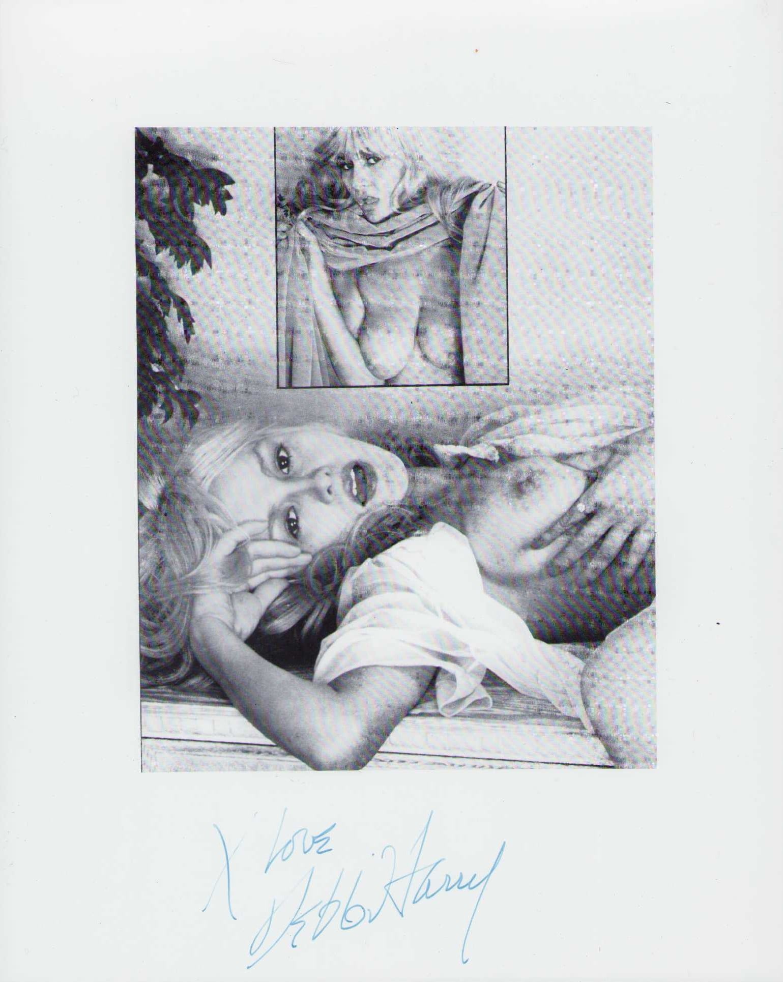 Debbie Harry vintage topless signed photograph: A rare VINTAGE signed Topless photo of Debbie Harry aka Blondie from her own home showing another nude of her behind her on the wall one of a kind Certificate of AuthenticityEVERY item in this auction