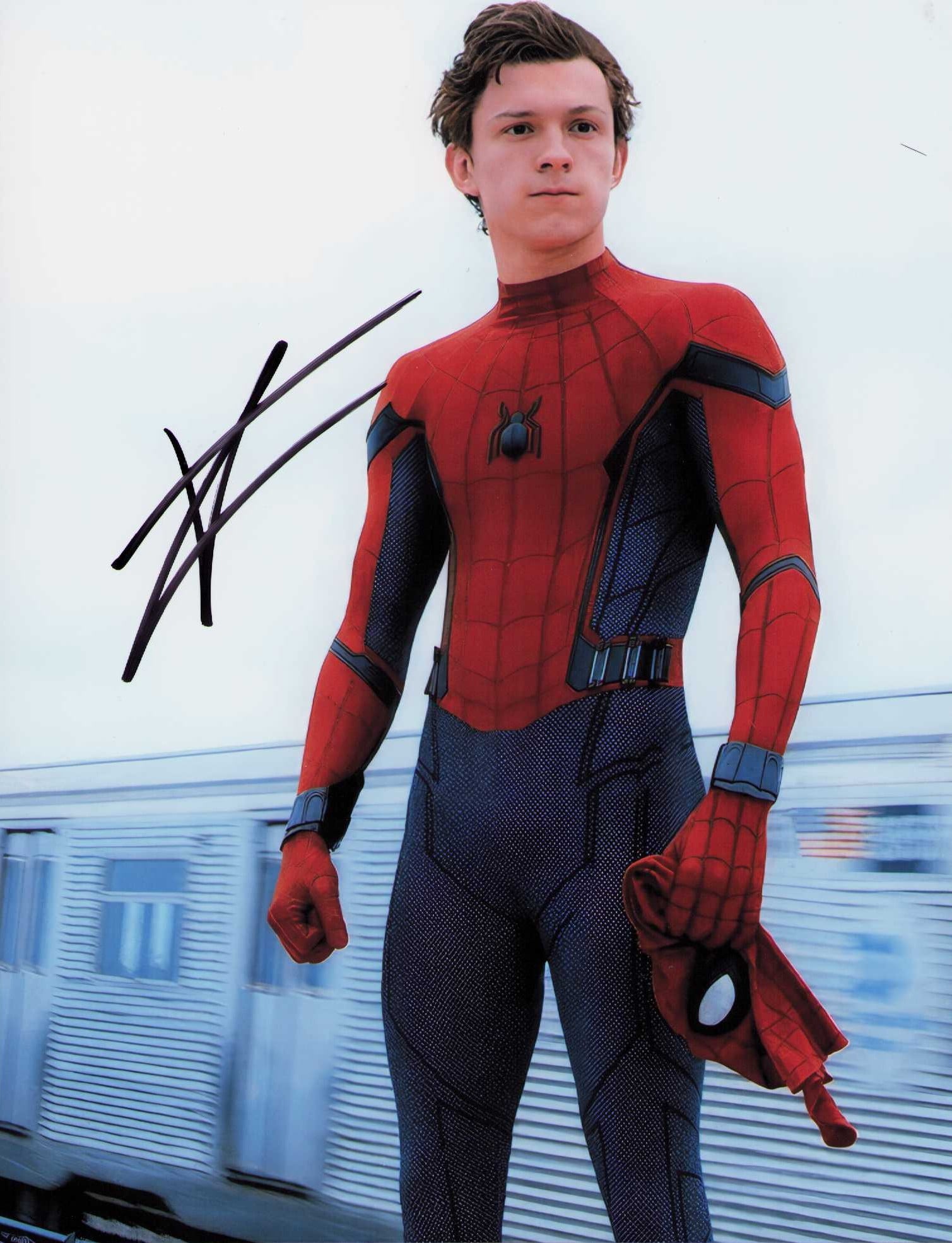 Tom Holland Spiderman signed photograph: A Spiderman signed 8x10 by actor Tom Holland the latest to wear the webs Certificate of AuthenticityEVERY item in this auction comes with at minimum a fully illustrated and serial numbered COA signed 