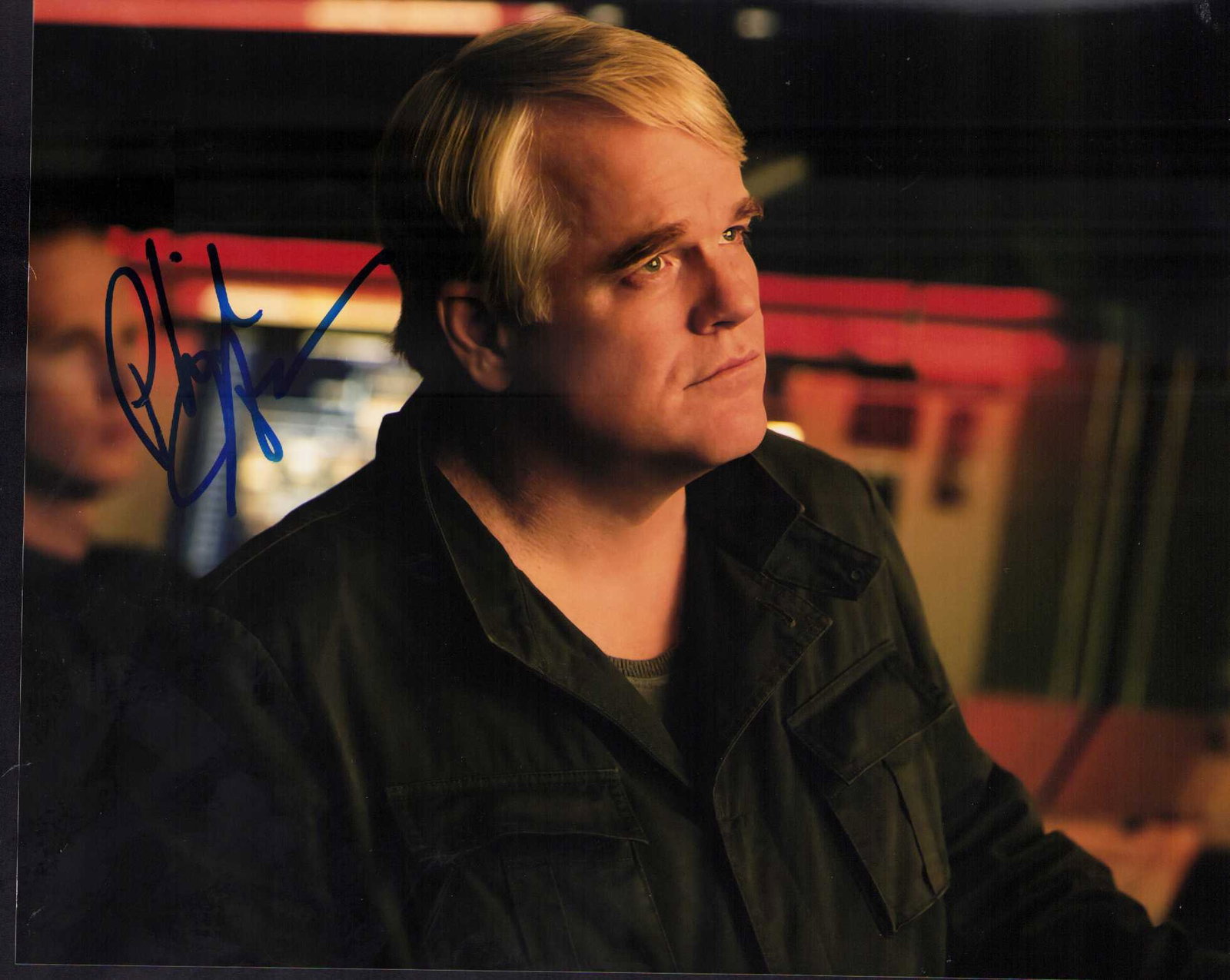 Phillip Seymour Hoffman signed photograph: A scarce Hunger Games signed by the star ini character who died tragically shortly afterwards Certificate of AuthenticityEVERY item in this auction comes with at minimum a fully illustrated and serial