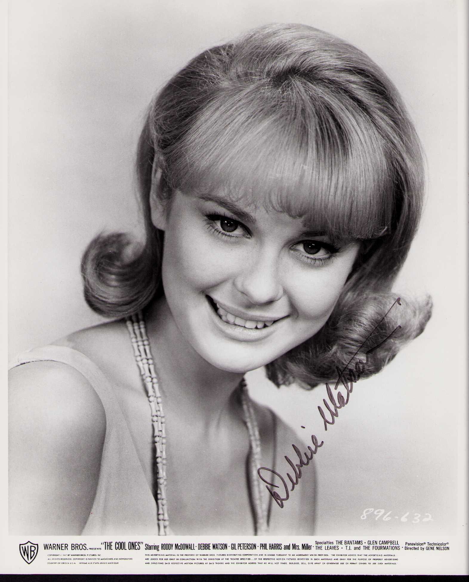 Debbie Watson rare signed photograph: A RARE signer she was Marilyn Munster in the movie signed vintage still Certificate of AuthenticityEVERY item in this auction comes with at minimum a fully illustrated and serial numbered COA signed b