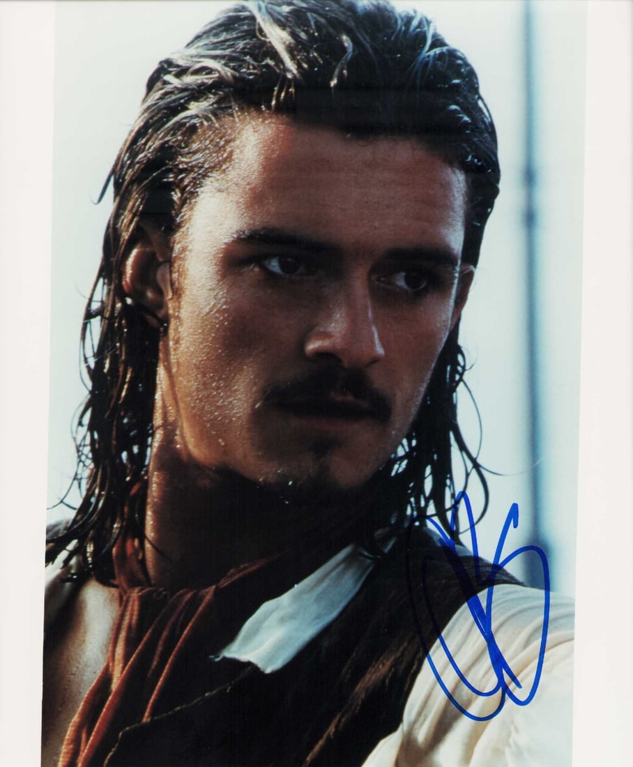 Orlando Bloom signed photo: From Pirates of the Caribbean signed 8x10 photo Certificate of AuthenticityEVERY item in this auction comes with at minimum a fully illustrated and serial numbered COA signed by the worlds leading aut