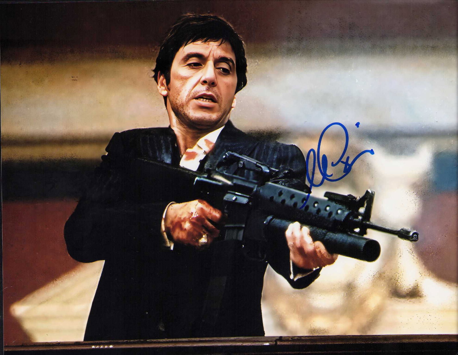 Al Pacino Scarface signed 8x10 photo: A Scarface with the machine gun shot signed by him 8x10 photograph Certificate of AuthenticityEVERY item in this auction comes with at minimum a fully illustrated and serial numbered COA signed by the