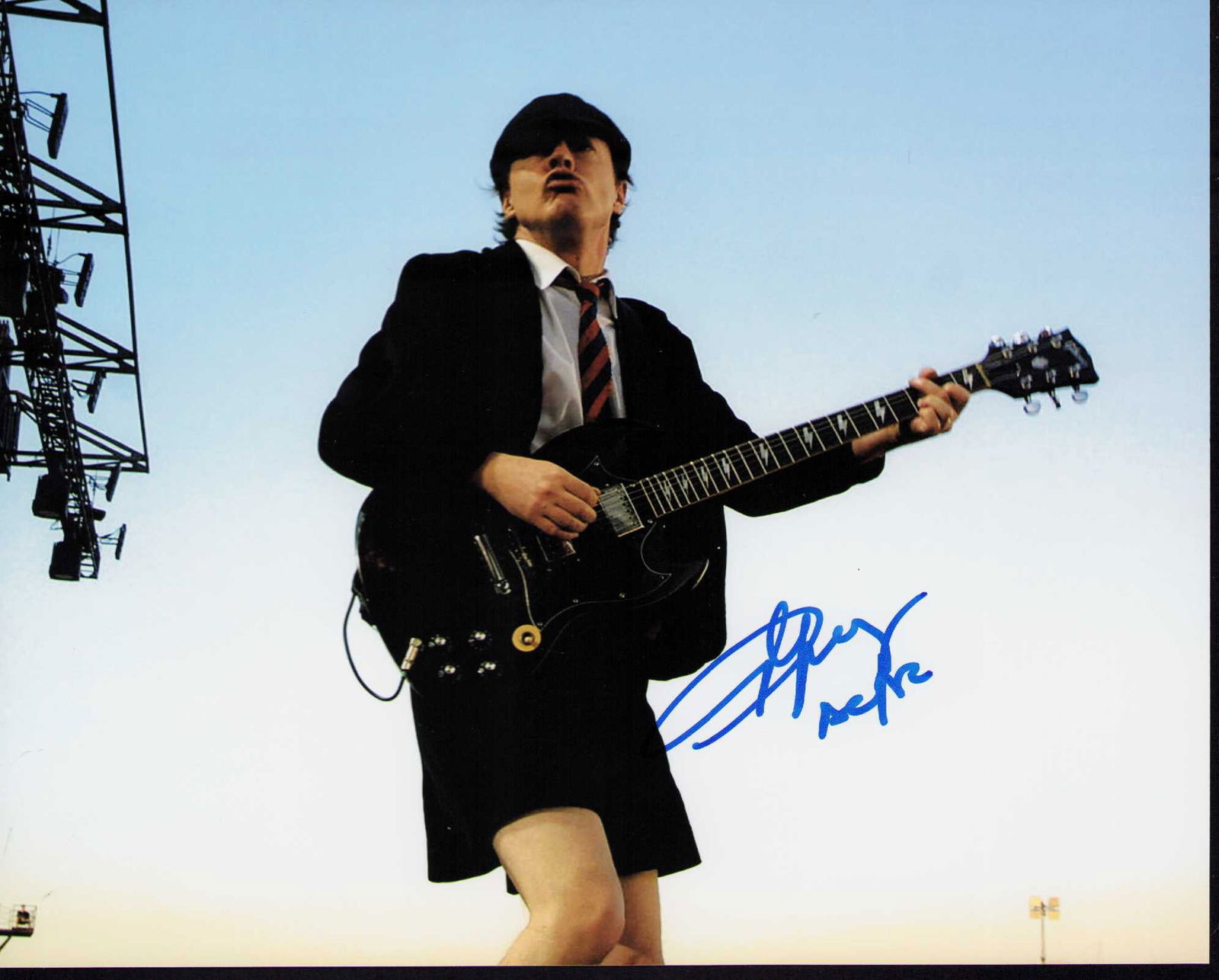 Angus Young signed photograph: Legendary AC DC guitarist signed 8x10 Certificate of AuthenticityEVERY item in this auction comes with at minimum a fully illustrated and serial numbered COA signed by the worlds leading