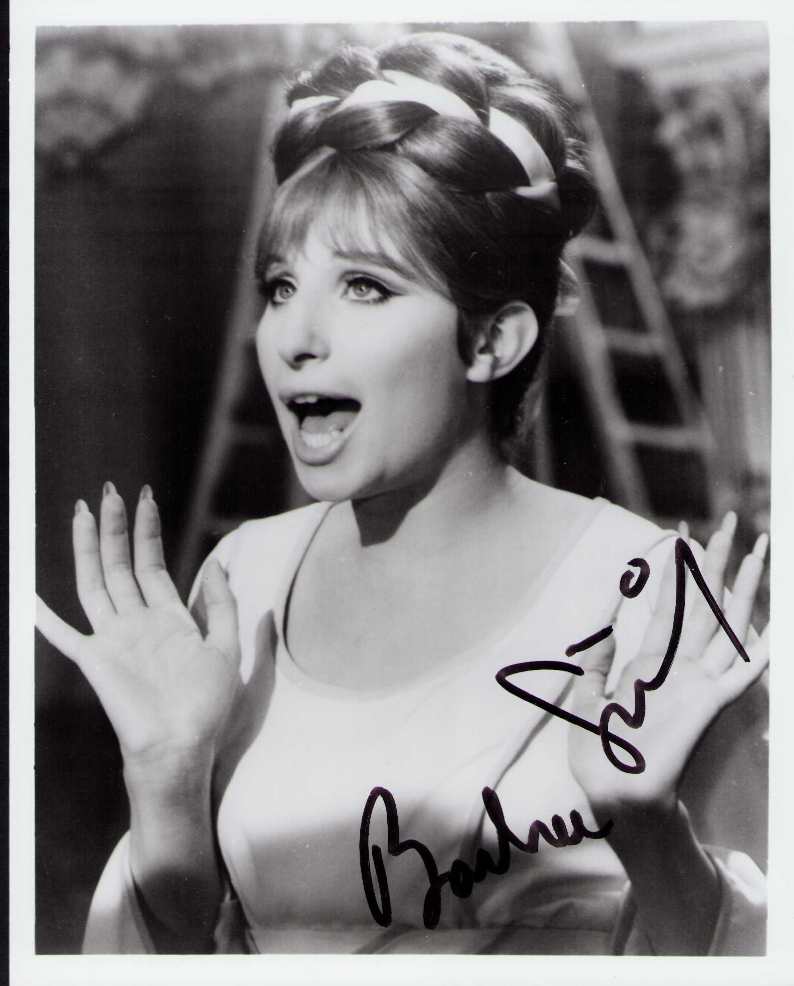 Barbra Streisand signed photograph: A rare vintage early signed 8x10 signed in FULL by her Certificate of AuthenticityEVERY item in this auction comes with at minimum a fully illustrated and serial numbered COA signed by the worlds lead