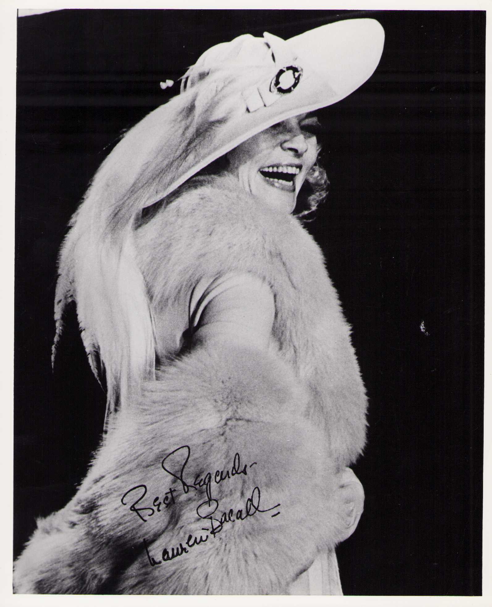 Lauren Bacall signed photograph: Rarely do you see VINTAGE signed photographs such as this great image we have never seen before ! Certificate of AuthenticityEVERY item in this auction comes with at minimum a fully illustrated and se