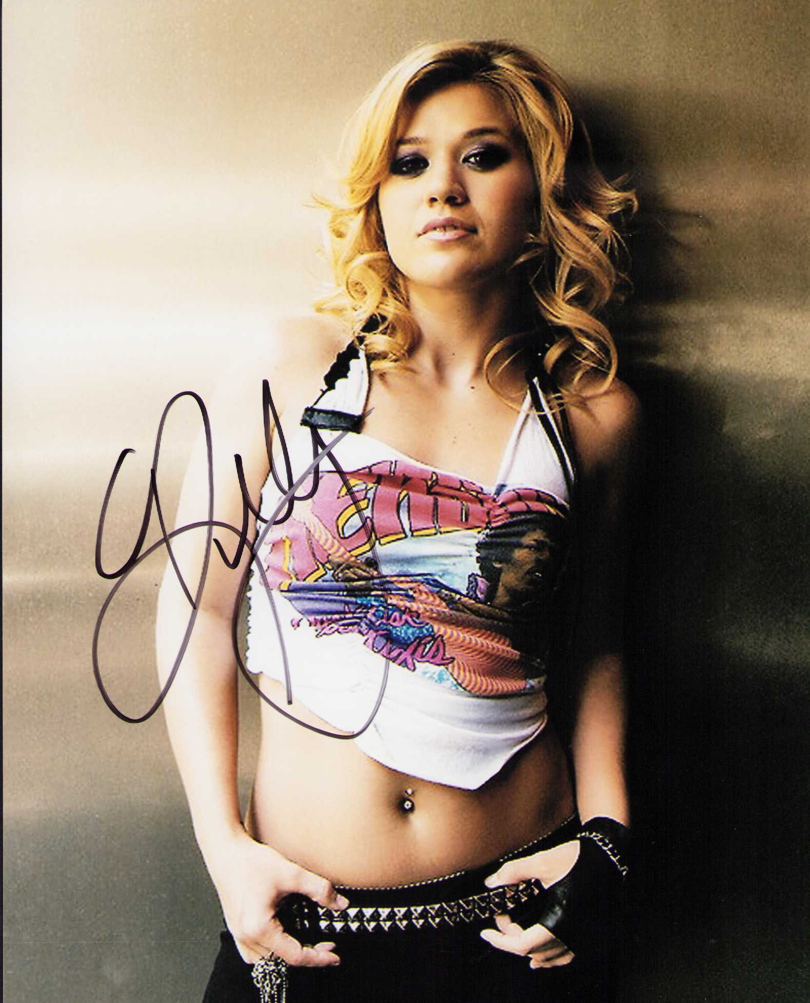 Kelly Clarkson signed photograph: A sexy young signed 8x10 of the singer and talk show host Certificate of AuthenticityEVERY item in this auction comes with at minimum one fully illustrated and serial numbered COA signed by the worlds